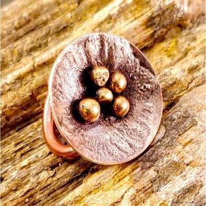 Brass beaded copper concave saucer ring w/ reticulated textured silver.